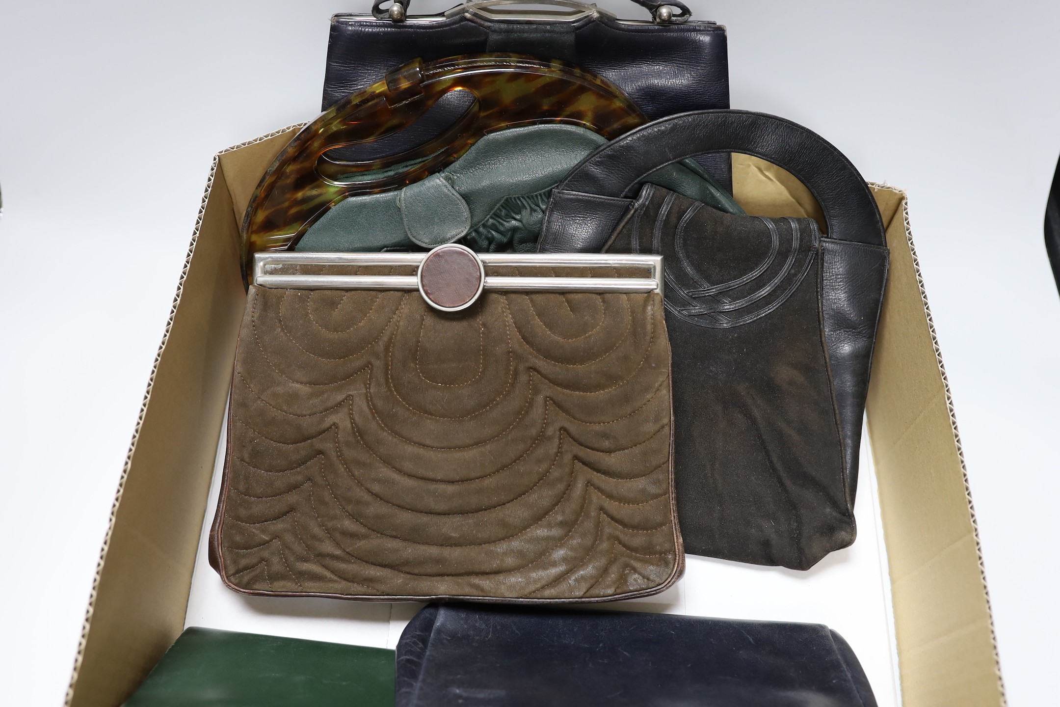 A collection of nine 1930's and 1940's leather, suede and crocodile ladies handbags with unusual metal clasps and frames
